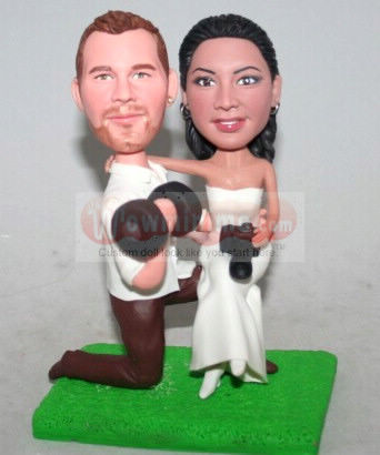 Groom lifting dumbbells cake toppers