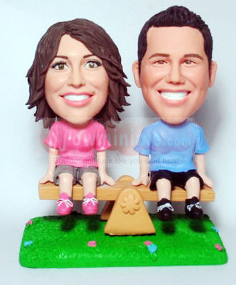 Couple Sitting on Bench Figurine