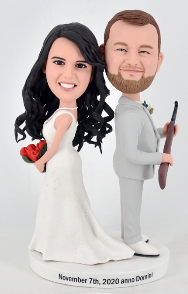 Custom cake toppers gun and rose wedding couples