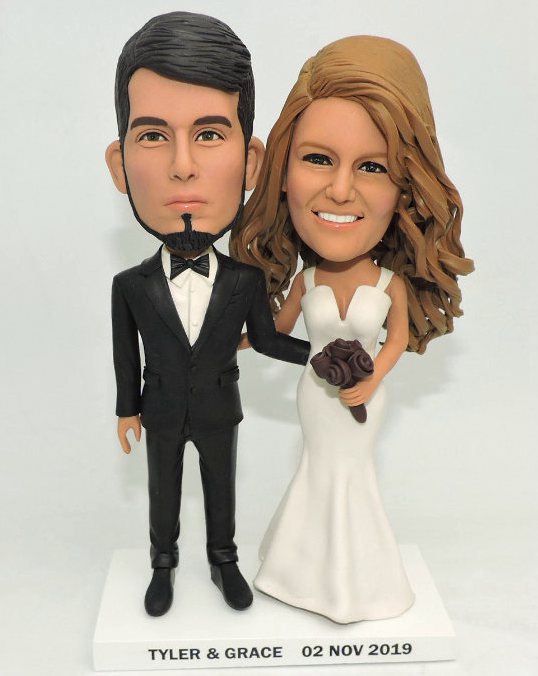 Custom cake toppers traditional groom holding bride's arm