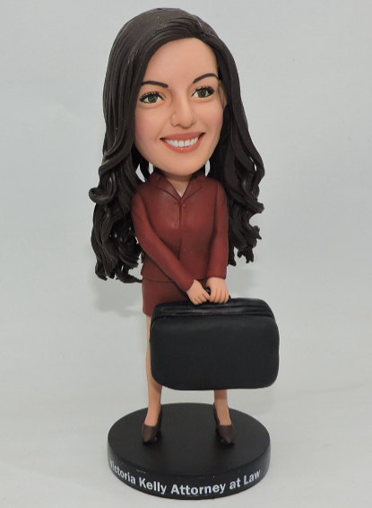 Custom Bobbleheads Figurines travel with a hand bag